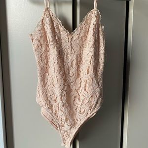 Nude lace body suit
